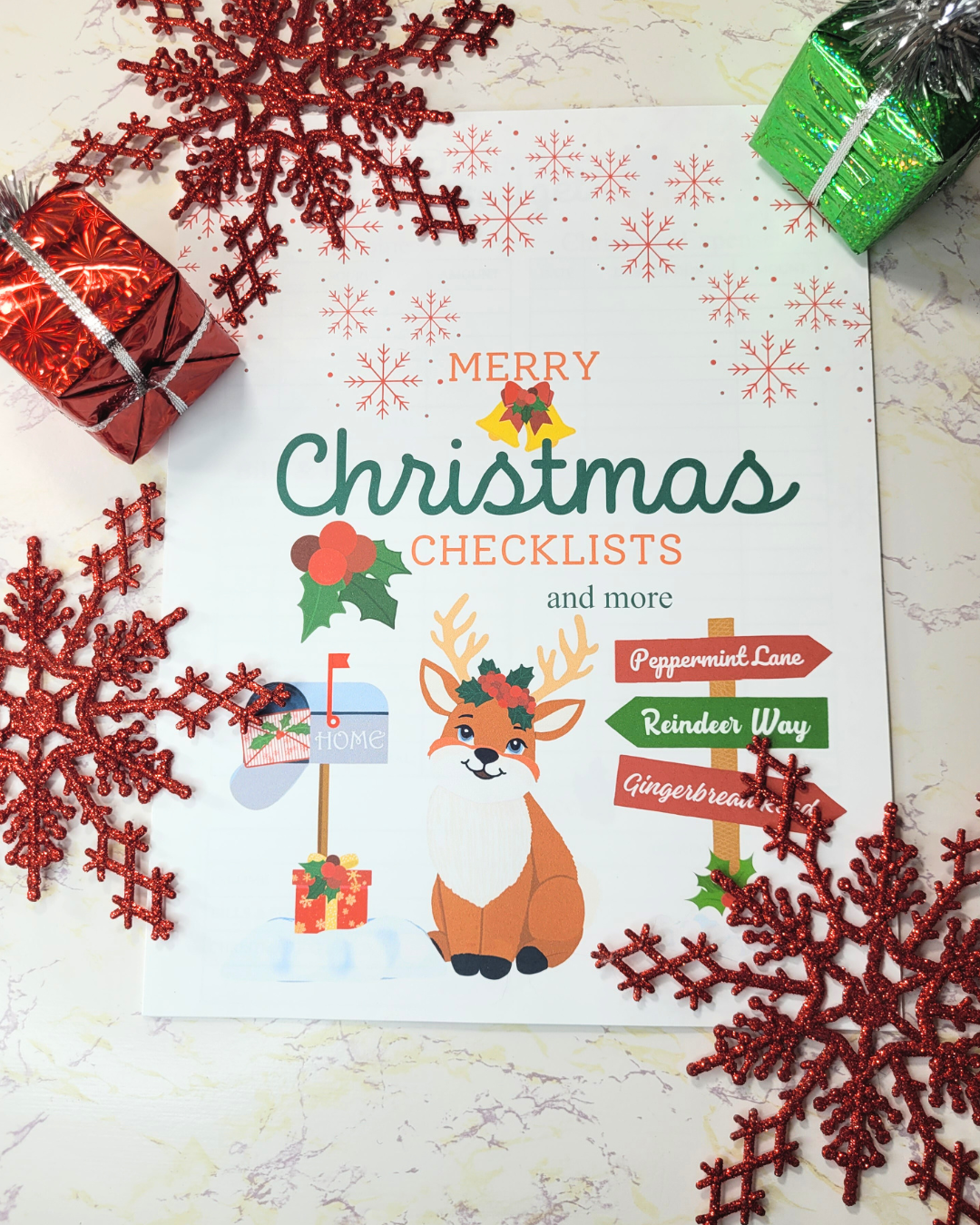 Flat lay of Create Lavender Christmas Checklists Printable background red snowflakes.